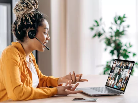 Woman participating in an online training session.